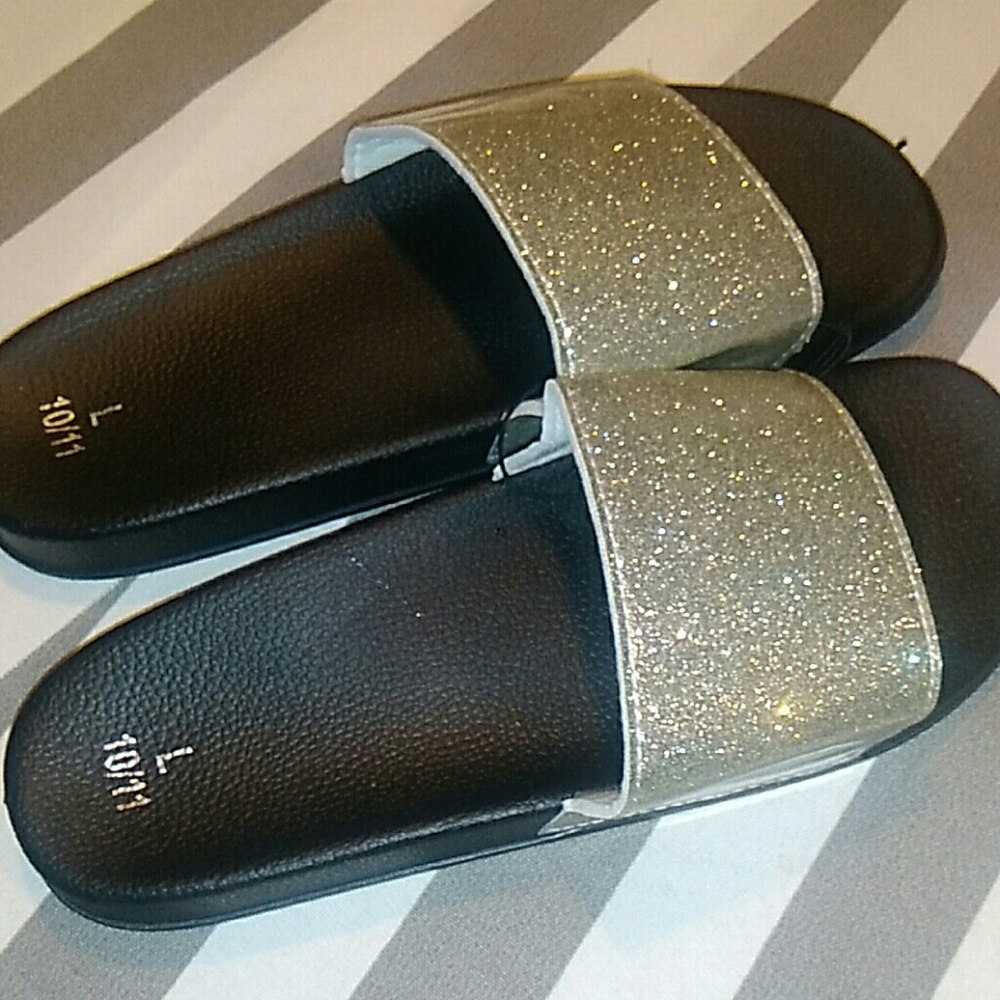 Silver and black flip flops